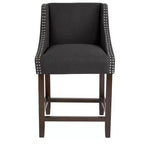 Sgabello da bancone in Leathersoft nero/antracite/grigio chiaro e tessuto, struttura in legno, finiture con borchie, 1 posto